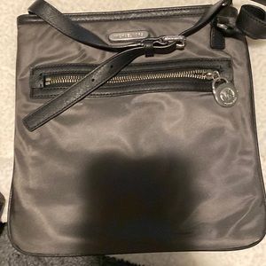 Michael kors cross body check out matching back pack for sale also